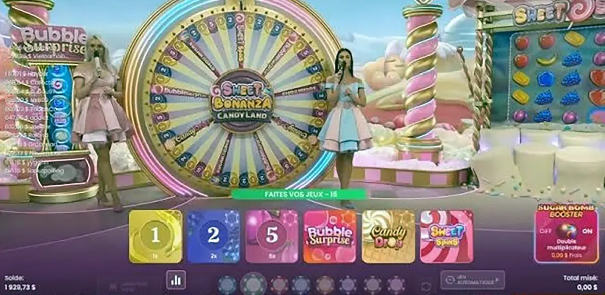 “Two live presenters stand beside a large illuminated bonus wheel on the Sweet Bonanza CandyLand game show set, with candy-themed columns, pastel scenery, and betting options displayed on the screen.”